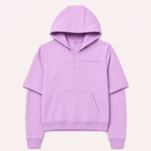 Front view of the FTR Frediorton Rody E’gah Blush pink half-zip hoodie, featuring a layered short-over-long sleeve design and a tonal left chest logo