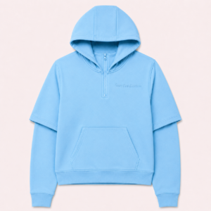 Front view of the FTR Frediorton Rody E’gah light sky blue half-zip hoodie, featuring a layered short-over-long sleeve design and a tonal left chest logo
